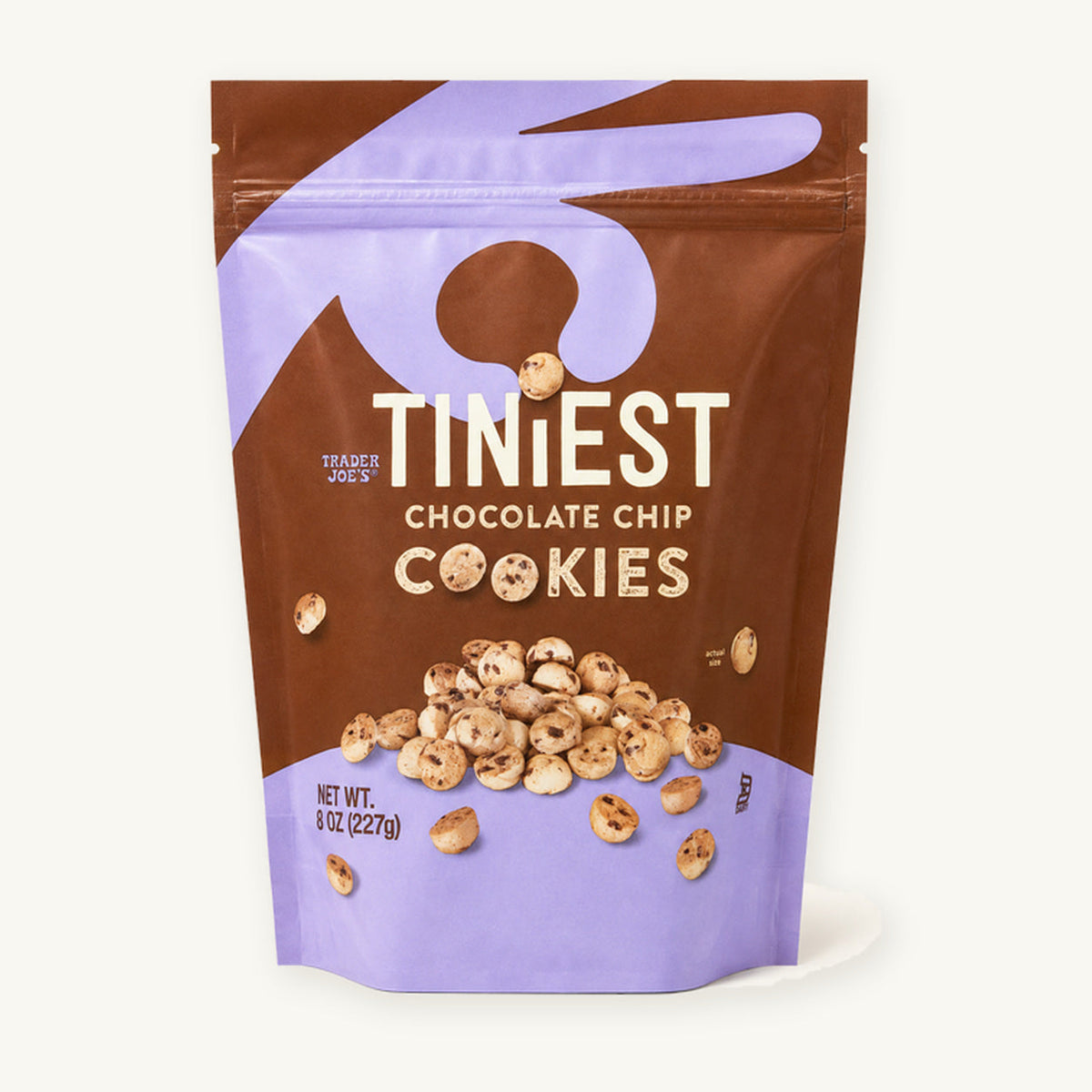 Trader Joe's Tiniest Chocolate Chip Cookies, 8 oz. Brown and purple pouch on a warm ivory background.